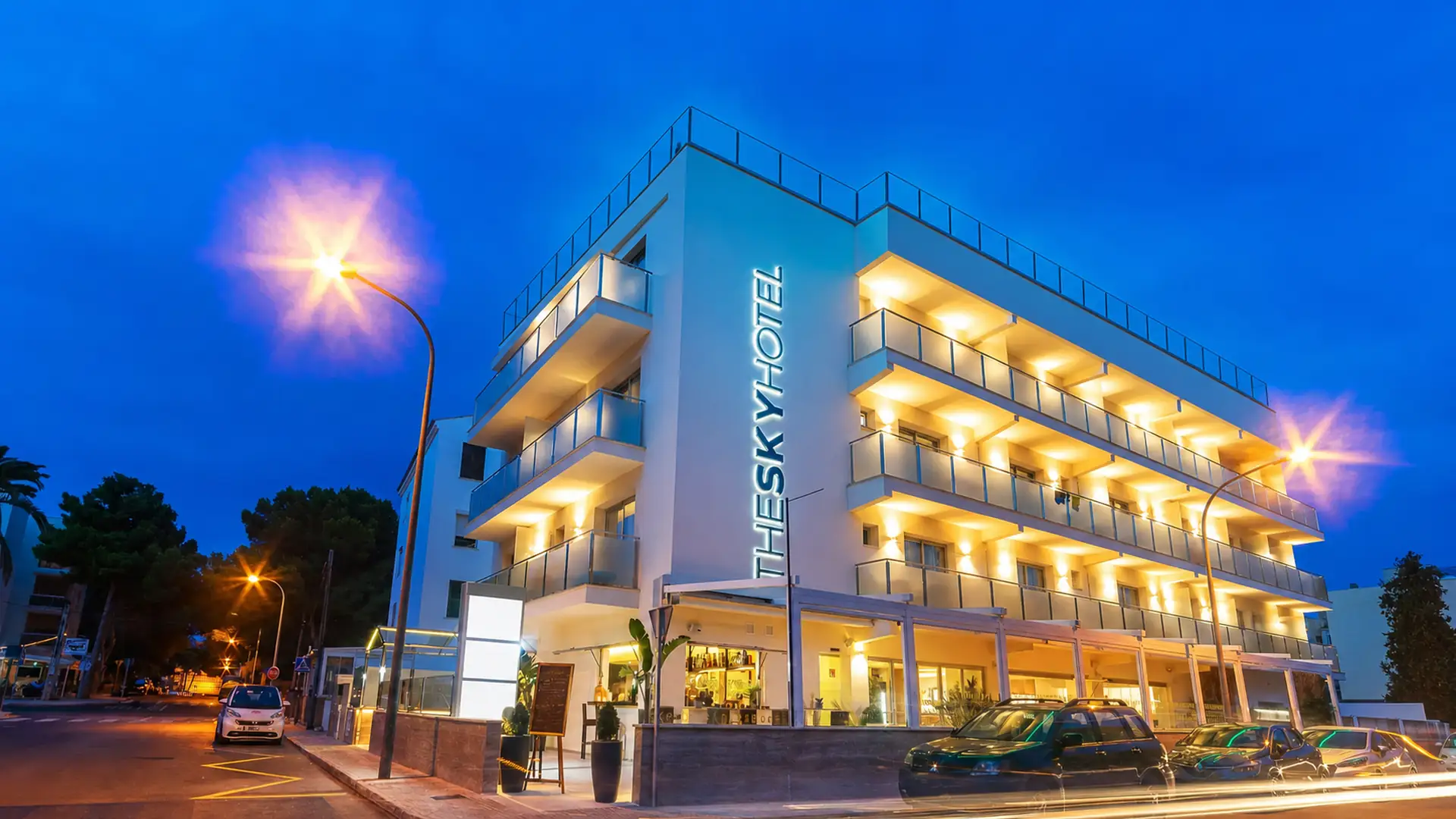 The illuminated façade of The Sky Hotel in Cala Ratjada